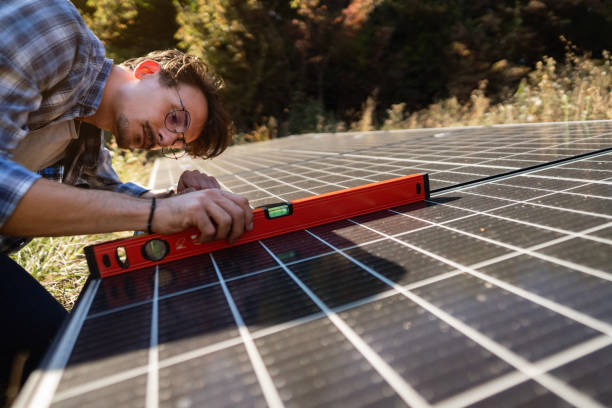 worker try to fix solar light sensor